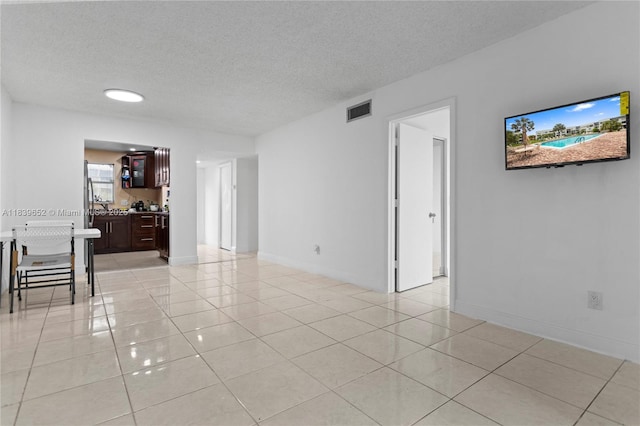 6600 Royal Palm Blvd Unit 103B, Margate, FL 33063 - unfurnished room with a textured ceiling and light tile patterned floors