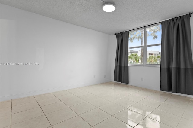 6600 Royal Palm Blvd Unit 103B, Margate, FL 33063 - empty room featuring a textured ceiling and light tile patterned floors