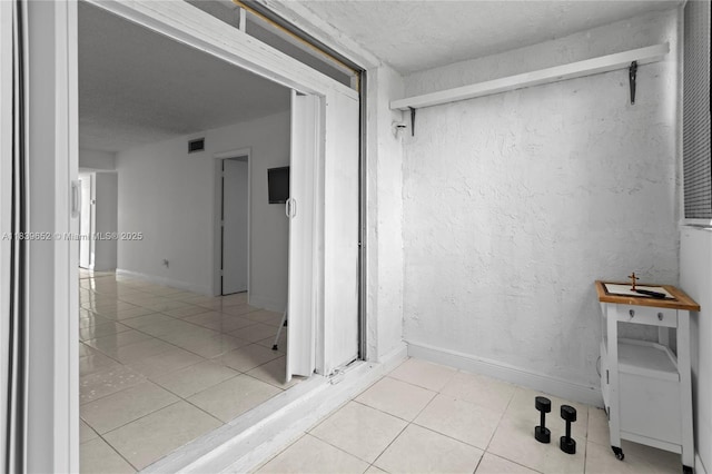 6600 Royal Palm Blvd Unit 103B, Margate, FL 33063 - bathroom with tile patterned floors and a textured ceiling