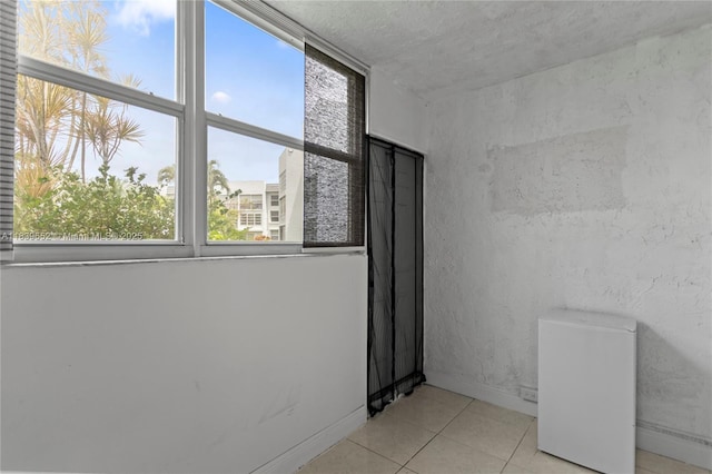 6600 Royal Palm Blvd Unit 103B, Margate, FL 33063 - empty room featuring light tile patterned floors and baseboards
