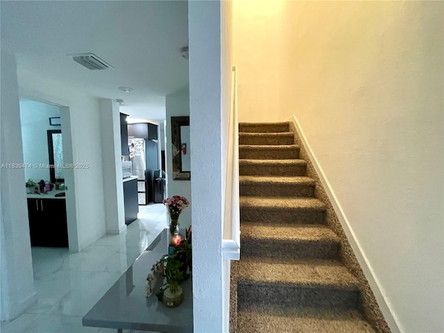 2957 NW 45th St, Miami, FL 33142 - staircase with baseboards