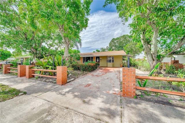 7140 Fillmore St, Hollywood, FL 33024 - ranch-style house with driveway and a fenced front yard