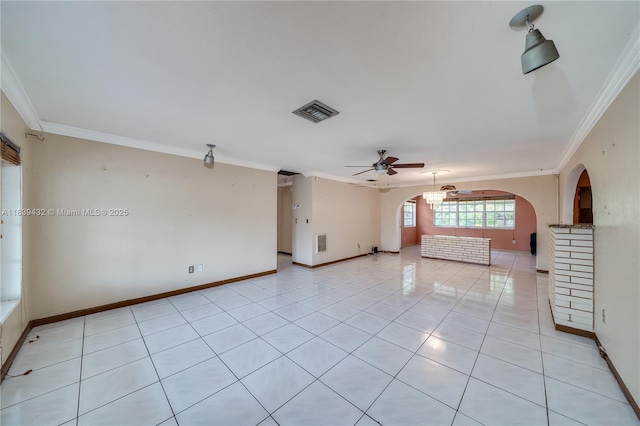 7140 Fillmore St, Hollywood, FL 33024 - unfurnished room featuring ornamental molding, arched walkways, ceiling fan, and light tile patterned flooring