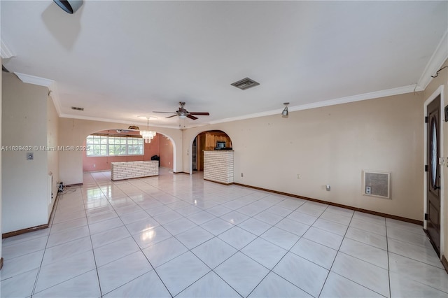 7140 Fillmore St, Hollywood, FL 33024 - unfurnished room with arched walkways, crown molding, light tile patterned floors, and ceiling fan