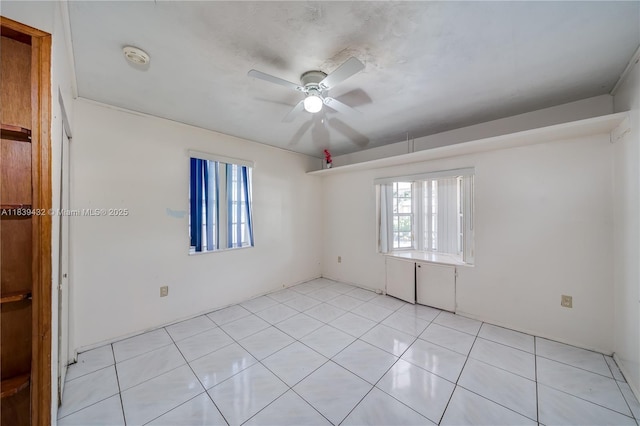7140 Fillmore St, Hollywood, FL 33024 - empty room with ceiling fan, a smoke detector, and light tile patterned flooring