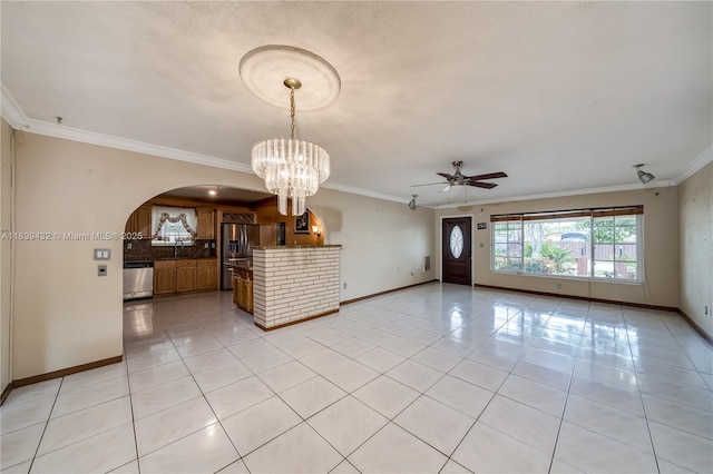 7140 Fillmore St, Hollywood, FL 33024 - unfurnished room featuring arched walkways, light tile patterned floors, crown molding, ceiling fan, and a chandelier