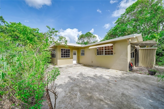 7140 Fillmore St, Hollywood, FL 33024 - view of front of house featuring stucco siding and a patio area