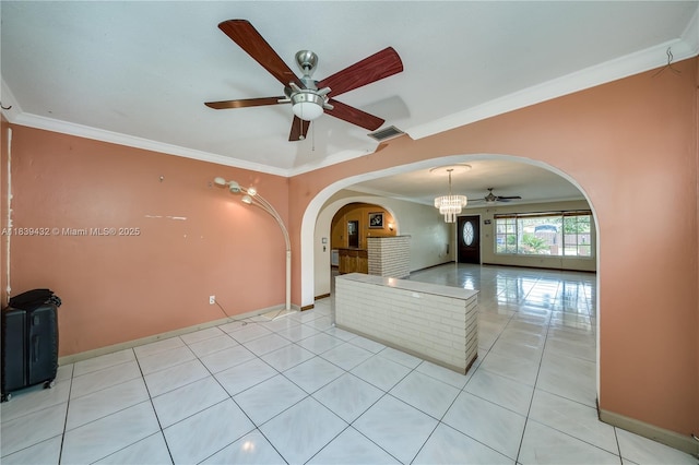 7140 Fillmore St, Hollywood, FL 33024 - unfurnished room with ceiling fan, arched walkways, ornamental molding, light tile patterned floors, and a chandelier