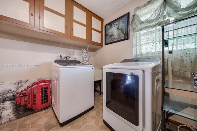 7140 Fillmore St, Hollywood, FL 33024 - laundry area featuring washer and dryer and cabinet space