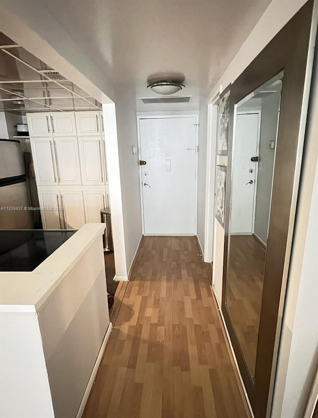 1228 W Ave Unit 911, Miami Beach, FL 33139 - corridor with wood finished floors and baseboards