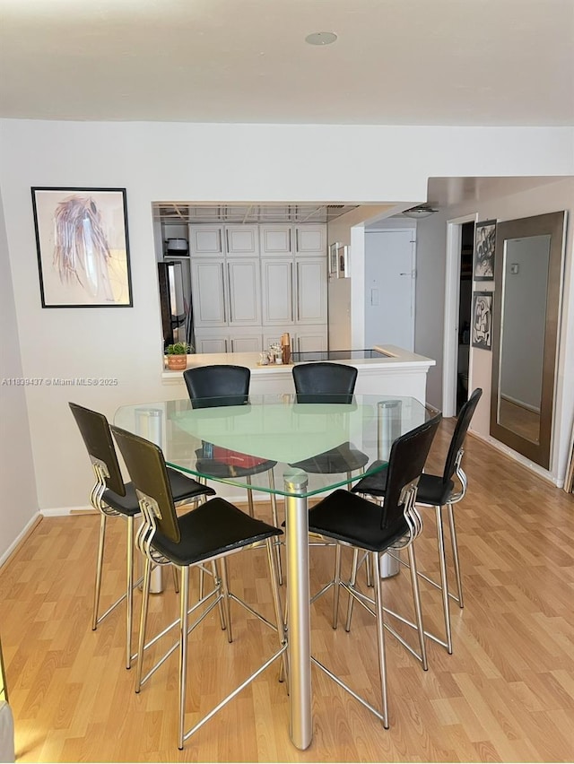 1228 W Ave Unit 911, Miami Beach, FL 33139 - dining room featuring light wood-style floors