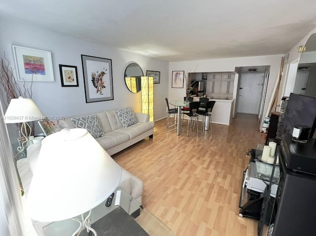 1228 W Ave Unit 911, Miami Beach, FL 33139 - living room with light wood-style floors
