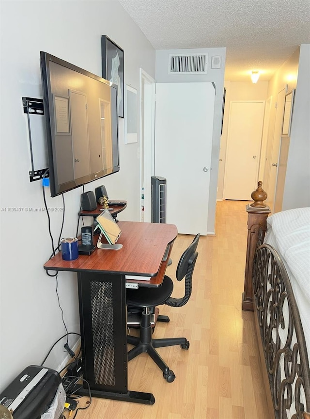 1228 W Ave Unit 911, Miami Beach, FL 33139 - office area with light wood-type flooring and a textured ceiling