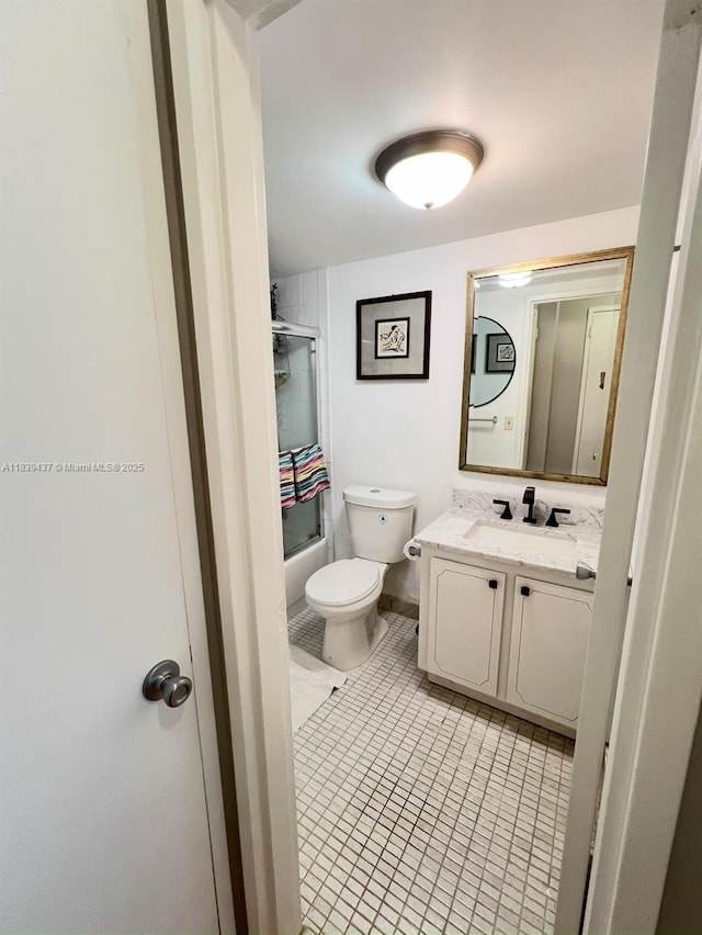 1228 W Ave Unit 911, Miami Beach, FL 33139 - full bath featuring vanity, bath / shower combo with glass door, and tile patterned floors
