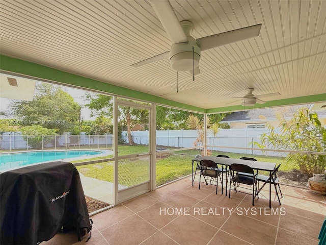 2359 Gabriel Ln, West Palm Beach, FL 33406 - sunroom featuring a ceiling fan and outdoor dining space