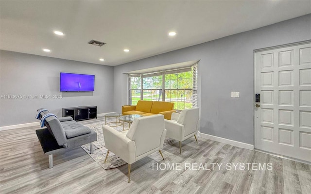 2359 Gabriel Ln, West Palm Beach, FL 33406 - living room featuring recessed lighting and wood finished floors