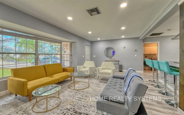 2359 Gabriel Ln, West Palm Beach, FL 33406 - living room featuring wood finished floors and recessed lighting