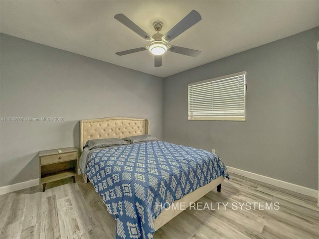 2359 Gabriel Ln, West Palm Beach, FL 33406 - bedroom with wood finished floors and a ceiling fan