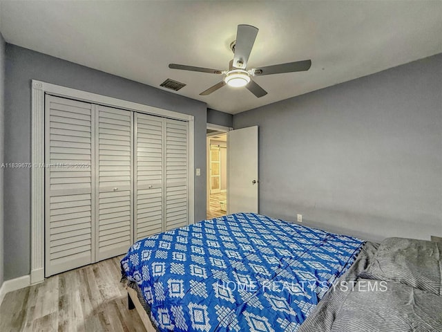 2359 Gabriel Ln, West Palm Beach, FL 33406 - bedroom with wood finished floors, a closet, and ceiling fan