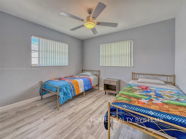 2359 Gabriel Ln, West Palm Beach, FL 33406 - bedroom featuring wood finished floors and ceiling fan