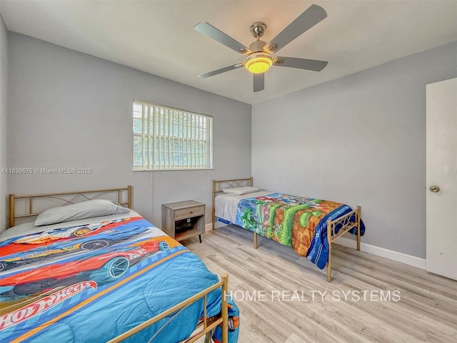 2359 Gabriel Ln, West Palm Beach, FL 33406 - bedroom featuring wood finished floors and a ceiling fan