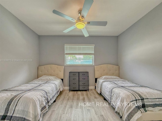2359 Gabriel Ln, West Palm Beach, FL 33406 - bedroom with wood finished floors and ceiling fan