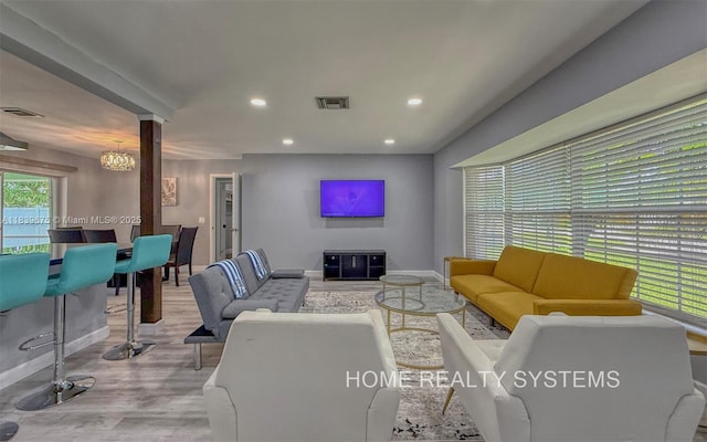 2359 Gabriel Ln, West Palm Beach, FL 33406 - living room with wood finished floors, recessed lighting, and ornate columns