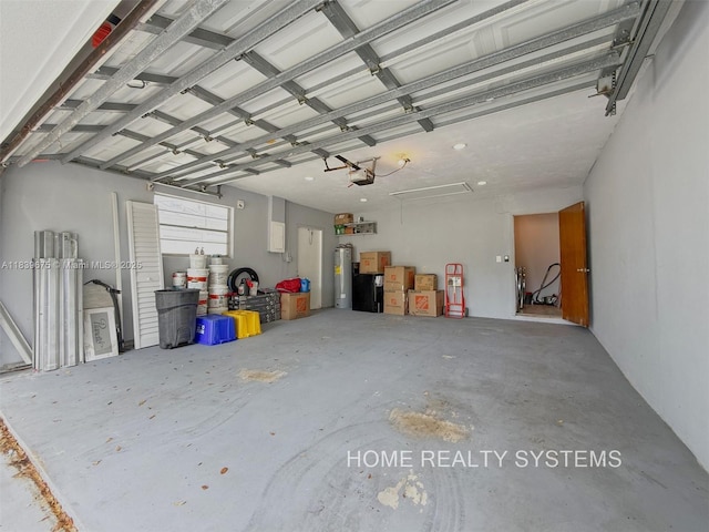 2359 Gabriel Ln, West Palm Beach, FL 33406 - garage with a garage door opener and water heater