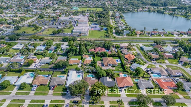 2359 Gabriel Ln, West Palm Beach, FL 33406 - aerial view of property and surrounding area featuring a large body of water and nearby suburban area