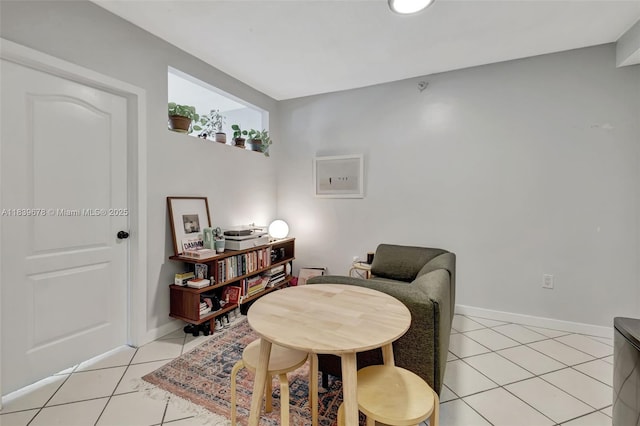 3051 SW 27th Ave Unit 402, Miami, FL 33133 - sitting room featuring light tile patterned floors and baseboards