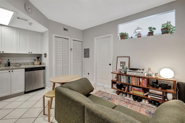3051 SW 27th Ave Unit 402, Miami, FL 33133 - living area with light tile patterned floors and electric panel