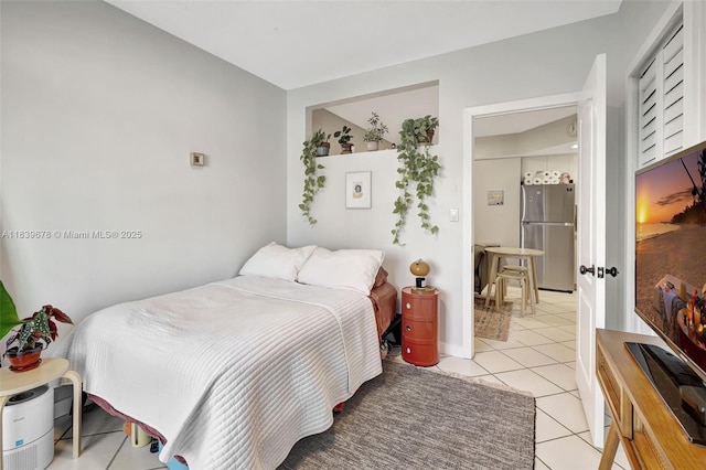 3051 SW 27th Ave Unit 402, Miami, FL 33133 - bedroom featuring freestanding refrigerator and light tile patterned floors
