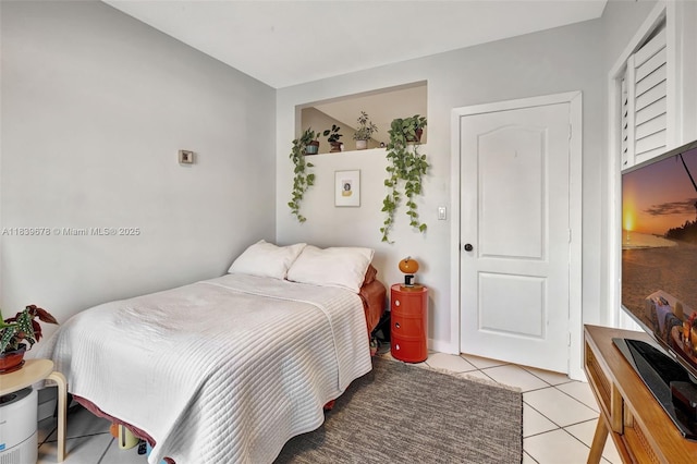 3051 SW 27th Ave Unit 402, Miami, FL 33133 - bedroom featuring light tile patterned floors