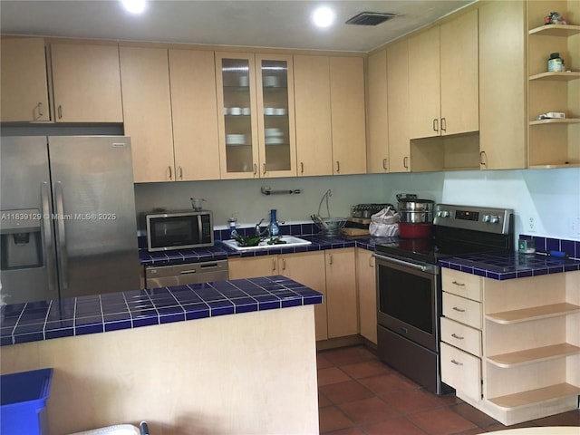 3521 SW 59th Ave, Miami, FL 33155 - kitchen with open shelves, stainless steel appliances, tile counters, dark tile patterned flooring, and recessed lighting