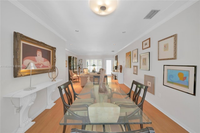 2665 SW 17th Ave, Miami, FL 33133 - dining space featuring ornamental molding, light wood-style flooring, and recessed lighting