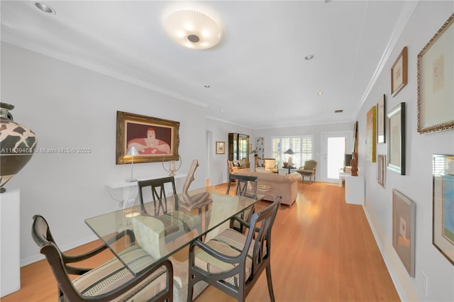2665 SW 17th Ave, Miami, FL 33133 - dining area featuring ornamental molding, light wood finished floors, and recessed lighting