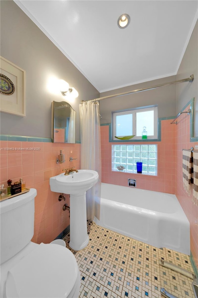 2665 SW 17th Ave, Miami, FL 33133 - full bath with tile walls, shower / bath combo with shower curtain, ornamental molding, tile patterned floors, and wainscoting