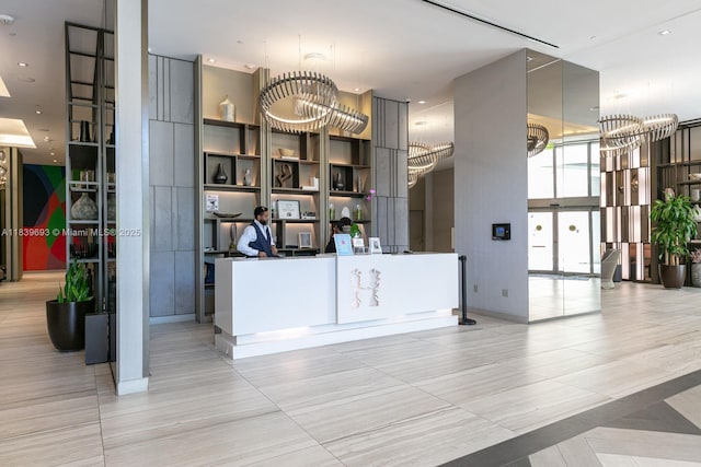 4010 S Ocean Dr Unit T4105, Hollywood, FL 33019 - reception with a chandelier and a wall of windows