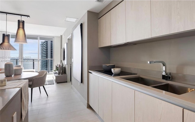4010 S Ocean Dr Unit T4105, Hollywood, FL 33019 - kitchen featuring light countertops, modern cabinets, and decorative light fixtures