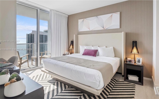 4010 S Ocean Dr Unit T4105, Hollywood, FL 33019 - bedroom with access to outside, multiple windows, floor to ceiling windows, and wallpapered walls