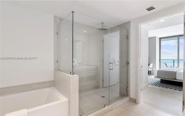 4010 S Ocean Dr Unit T4105, Hollywood, FL 33019 - bathroom featuring ensuite bathroom, a shower stall, a bath, and tile patterned flooring