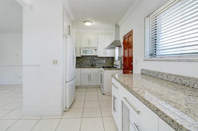 350 75th St Unit 201, Miami Beach, FL 33141 - kitchen with white appliances, wall chimney range hood, light tile patterned floors, backsplash, and ornamental molding