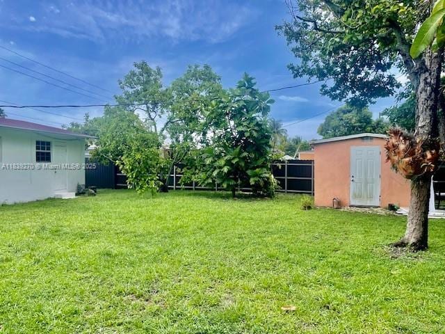 140 NW 199th St, Miami Gardens, FL 33169 - view of yard with a storage unit