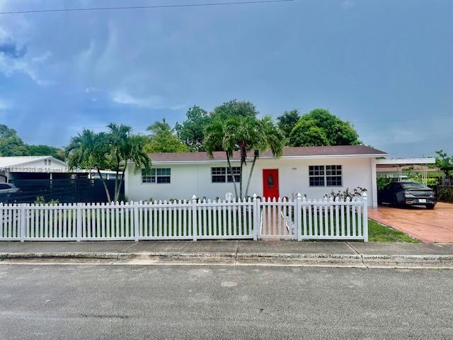 140 NW 199th St, Miami Gardens, FL 33169 - ranch-style home with a fenced front yard