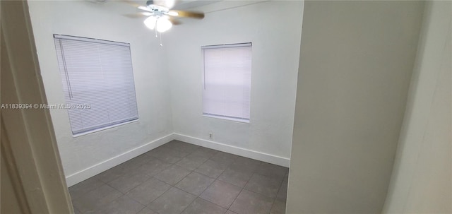 1887 NW 66th St, Miami, FL 33147 - empty room featuring dark tile patterned floors and a ceiling fan