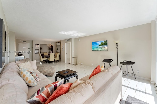 3140 S Ocean Dr Unit 212, Hallandale Beach, FL 33009 - living room featuring a chandelier and light tile patterned floors