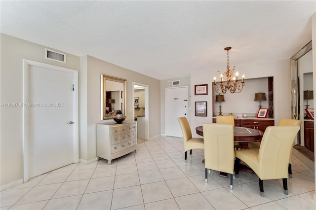3140 S Ocean Dr Unit 212, Hallandale Beach, FL 33009 - dining space featuring a chandelier and light tile patterned flooring