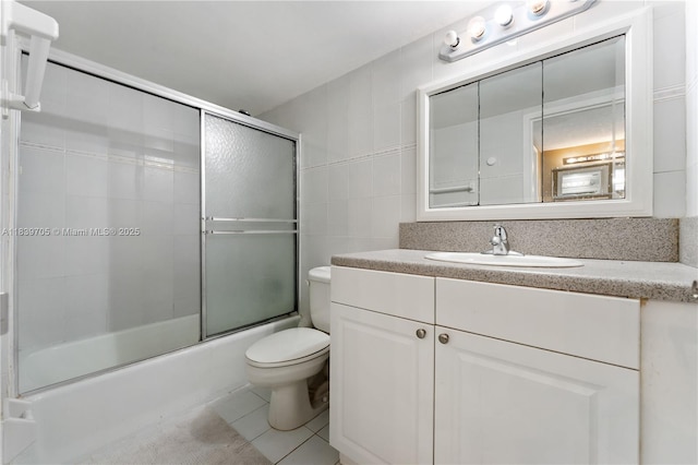 3140 S Ocean Dr Unit 212, Hallandale Beach, FL 33009 - full bath with vanity, shower / bath combination with glass door, tile walls, and tile patterned floors