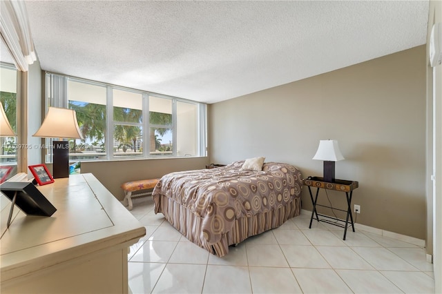 3140 S Ocean Dr Unit 212, Hallandale Beach, FL 33009 - bedroom with multiple windows, a textured ceiling, and light tile patterned flooring