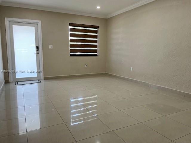 330 W 40th Pl, Hialeah, FL 33012 - unfurnished room with light tile patterned floors, ornamental molding, and recessed lighting